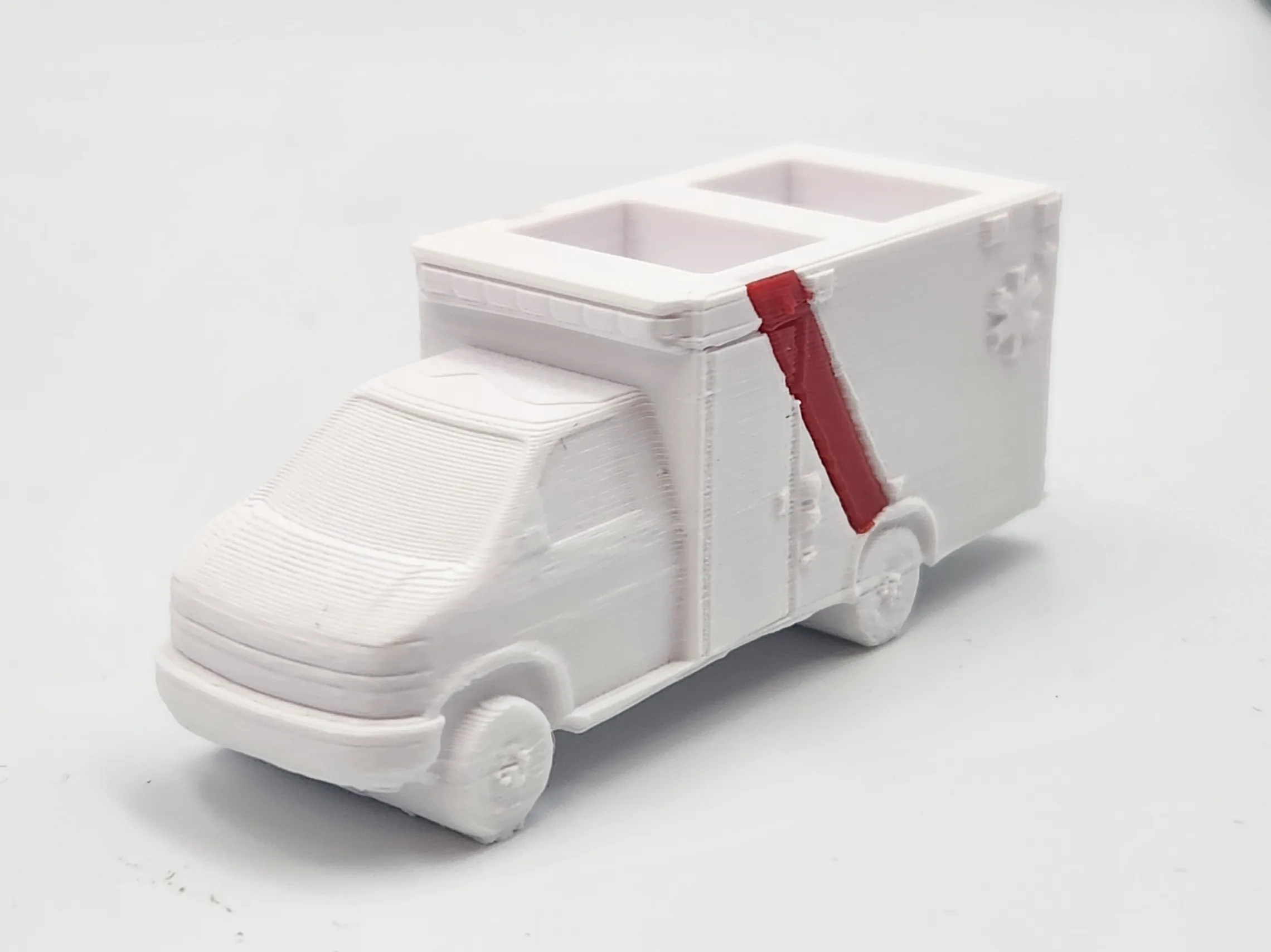 3D-printed BCEHS ambulance models in matching livery